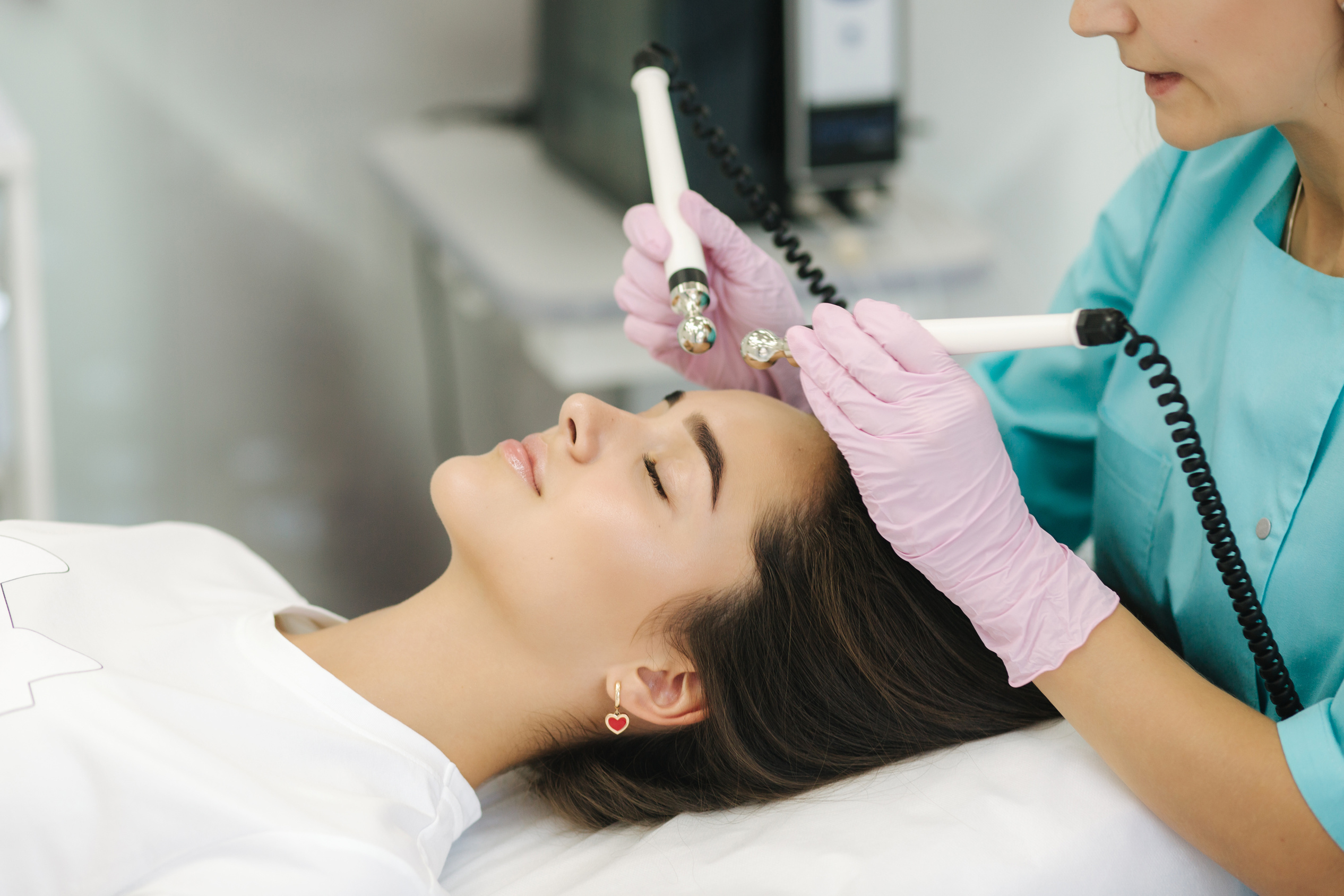 Young Woman Taking Beauty Procedure in Spa Salon. Electrophoresis